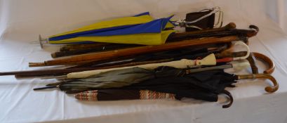 Walking sticks, umbrellas etc .