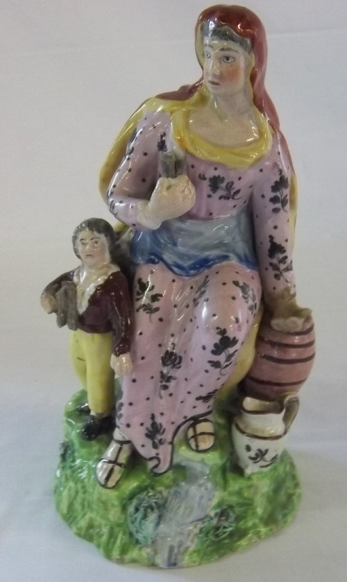 Early 19th cent Pearlware figure of the widow Zarephath with child (AF)