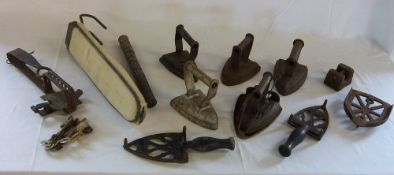 Various period irons with trivets, animal trap, portable ironing board and weight