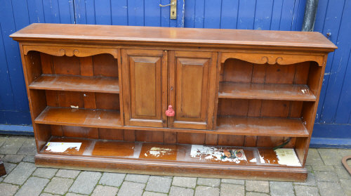 Shelving unit with panelled cupboard