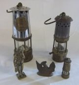 Two miners lamps and brass items