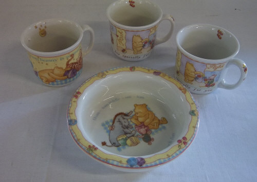 4 pieces Royal Doulton Winnie the Pooh consisting of 3 cups & a bowl