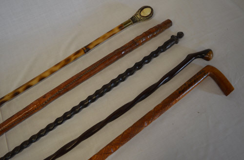 5 walking sticks inc H.M.S Victory topped & leather bound walking stick