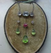 Necklace consisting of Peridot, Ruby, White Sapphire and Aquamarine stones on a white gold chain