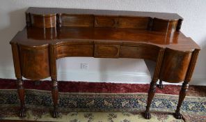 A fine Regency Mah sideboard with ebony stringing & reeded columns on paw feet with bow fronted