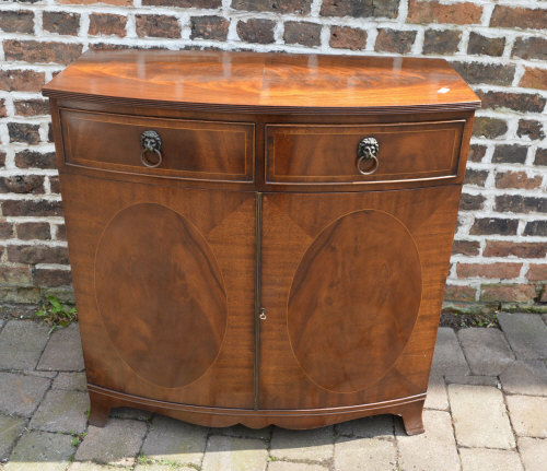 Regency style cabinet with lions head handles