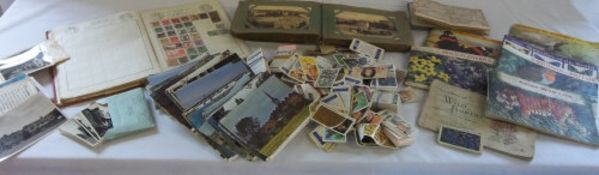 Box of postcards, cigarette albums and cards & stamps