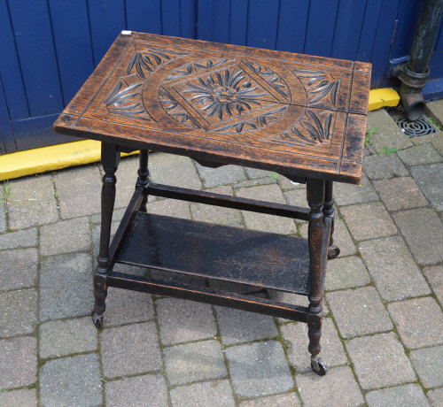 Trolley table with carved top