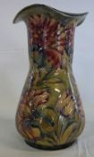 Early 20th cent Moorcroft Spanish design vase with flared rim made for Liberty & Co with printed
