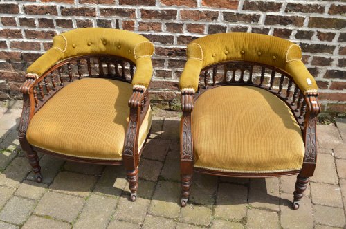 Pr of Vict Mah tub library chairs upholstered in a mustard coloured velvet, raised on turned and