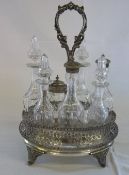 Vict S.P seven bottle condiment set fitted with central handle and matching cut glass bottles by