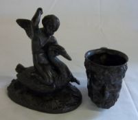A bronze Bacchus mug & a bronze Putto riding on a swan