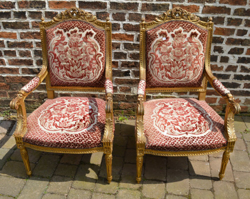 Pr of Louis XVI style gilt open armchairs upholstered in a velvet fabric on a sprung seat raised