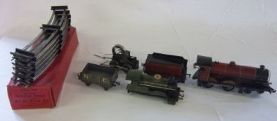 2 model tin plate trains & a box of curved track