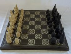 Ceramic chessboard with simulated ivory pieces