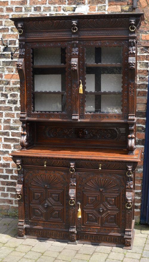 Late 19th/early 20th cent heavily carved oak display bookcase.