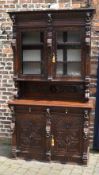 Late 19th/early 20th cent heavily carved oak display bookcase.