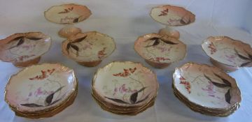 An 18 piece Limoges dessert service comprising of 6 comports & 12 plates