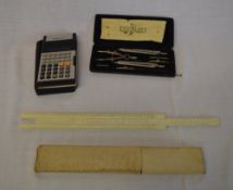 Sliderule, Casio calculator & box of draughtsman's tools