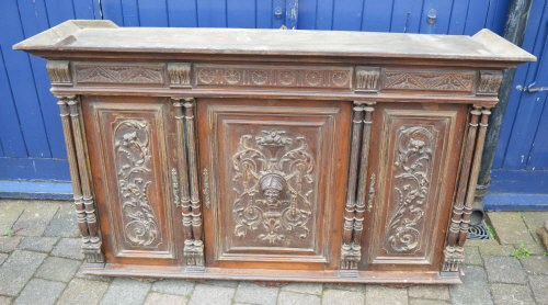 Heavily carved continental cabinet
