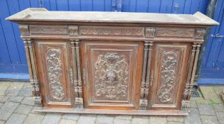 Heavily carved continental cabinet