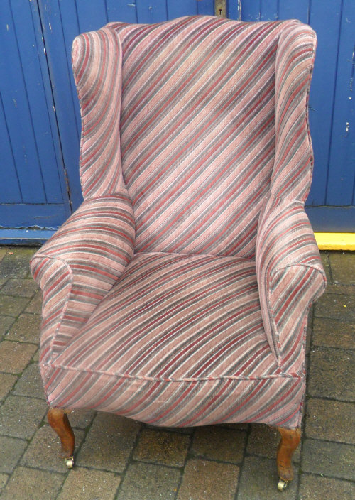 Winged arm chair with cabriole legs