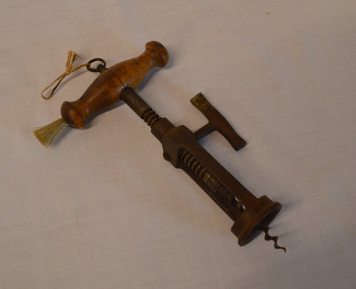 Late 19th cent rack and pinion corkscrew with a turned wood handle and brush