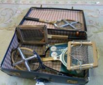 Suitcase of vintage tennis racquets, presses and boxed tennis balls etc