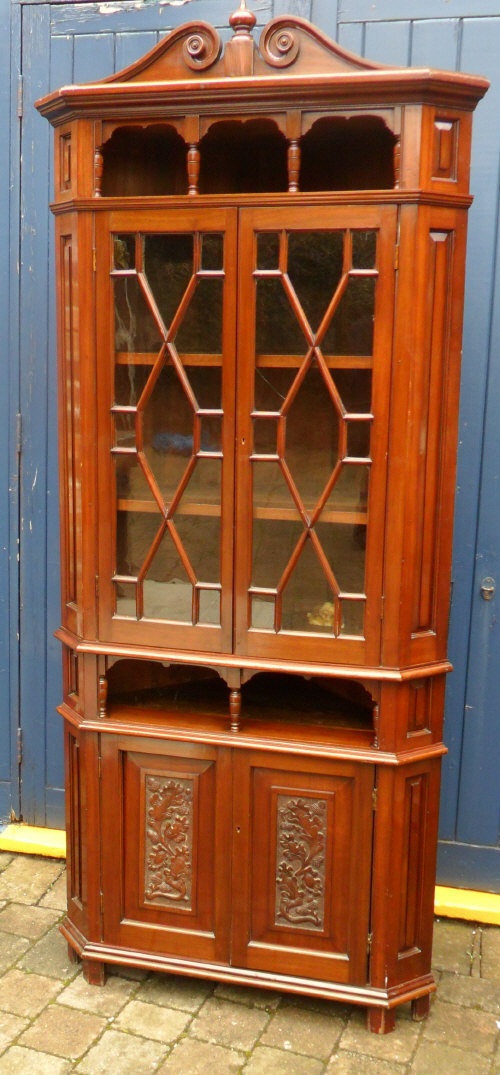 An ornate Edw. corner display cabinet
