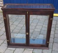 Glass fronted display cabinet with shelves