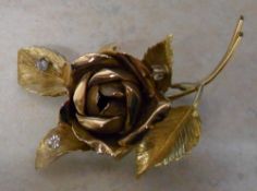 18ct gold rose brooch set with 3 diamonds