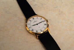 Garrard 9ct gold gents watch with Garrard leather strap, engraved to the reverse 'Presented by