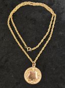 9ct rose gold medallion on a 9ct gold chain 15g