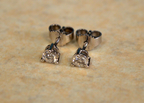 Pair of diamond earrings set in 18ct white gold