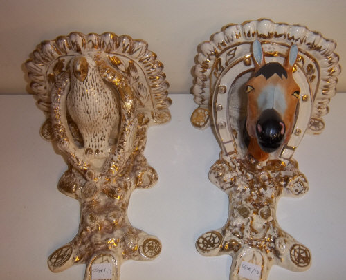 2 wall sconces, one parrot design, one horse design