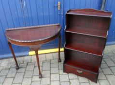 Demi lune side table with ball & claw feet & a mah book case