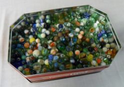 Lg tin of assorted marbles