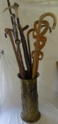 Sel of walking sticks inc a horse measure in a brass stand