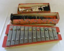 A 'Pixiphone' xylophone, Tri-ang trumpet and clarinet