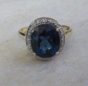 9ct gold blue topaz ring - size approx T 1/2