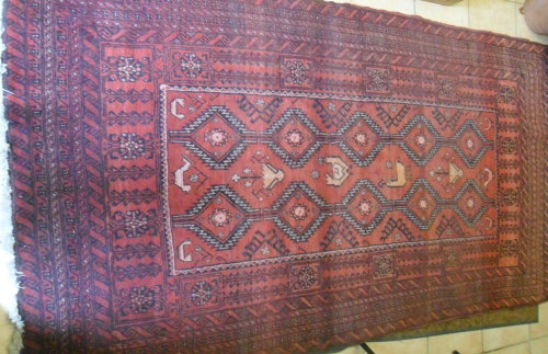 Red Persian rug, size 216cm x 120cm