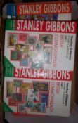 Box of Stanley Gibbons stamp catalogues in binders, volumes 1, 2 & 3 stamps of the world & 4 British