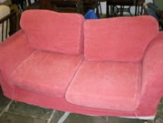 Lge red 2 seater sofa with loose covers
