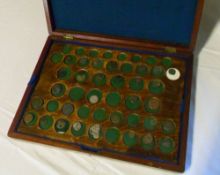 Mixed coins in wooden collectors box