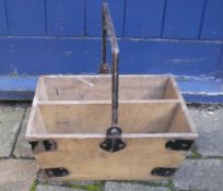 Old wooden carrying box with metal handle