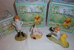 3 boxed Royal Doulton Winnie the Pooh figurines, Christopher Robin, Christopher Robin & Pooh &