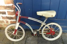 Child's bicycle with 'Mobo' on the pedals