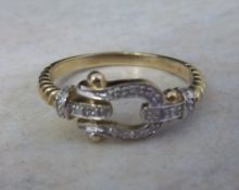 9ct gold & diamond buckle ring - size approx T