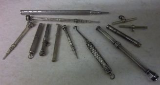 7 silver propelling pencils, 1 silver handled button hook, etc