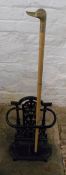 Sm cast iron umbrella stand & a duck head walking stick